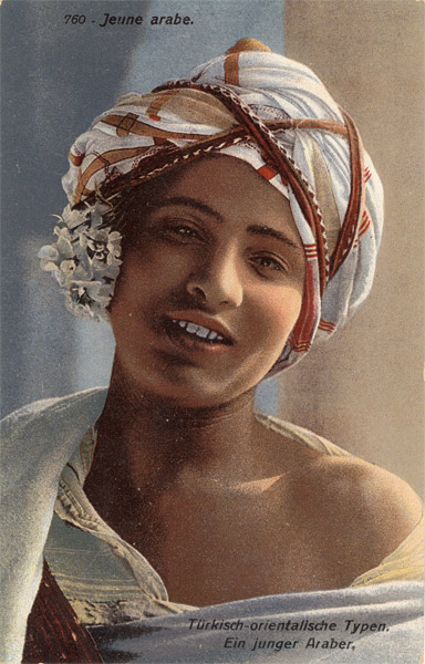 File:Colorized postcard showing a turbaned arab boy with jasmine flowers over his ear.png