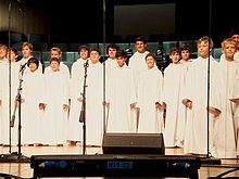 Libera on stage with their typical white robes during a concert in Houston, 9 August 2011.