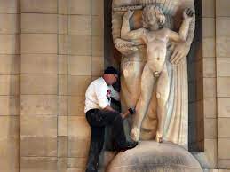 File:Man attacks Eric Gill statue.jpg