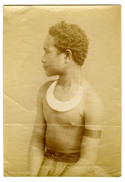 File:Portrait of profile of Papua New Guinean boy, seated, wearing neck ornament, armlet, skirt with belt.png